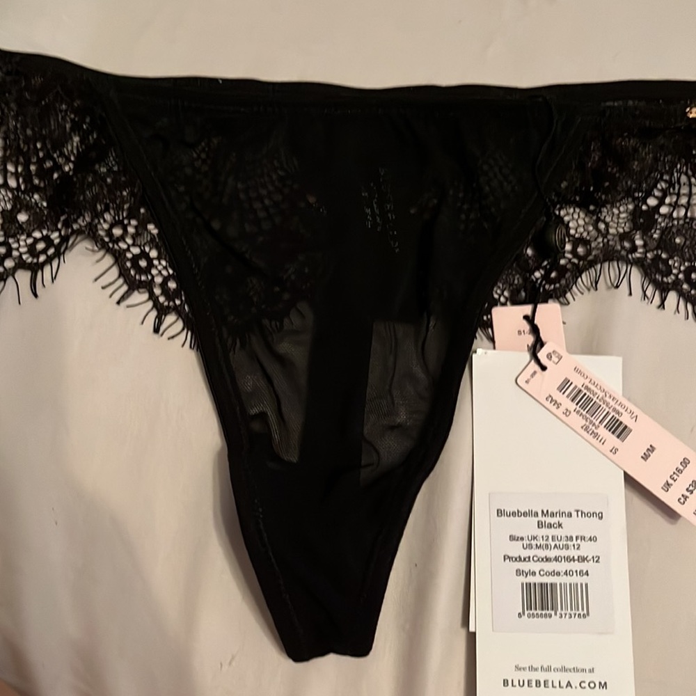 Mostly black lace, sheer coverage to front area. Thin thong area. - Picture 2 of 8